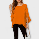 Agnes – Bluse med Flydende Stof og Volanger